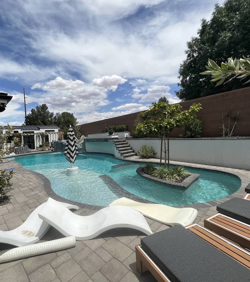 Serviced pool with a mountain backdrop