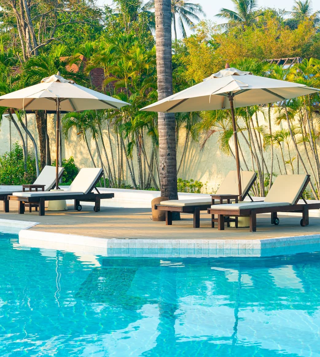 Relaxing pool with umbrellas and chairs