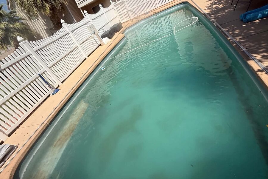 The same pool green and untreated before service